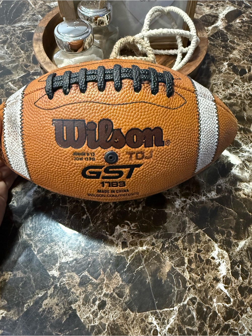 Wilson Youth GST 178 Football in Brown with White Stripes